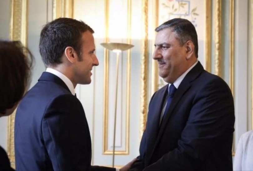 حجاب في لقاء مع الرئيس الفرنسي يدعوا لمحاسبة الأسد