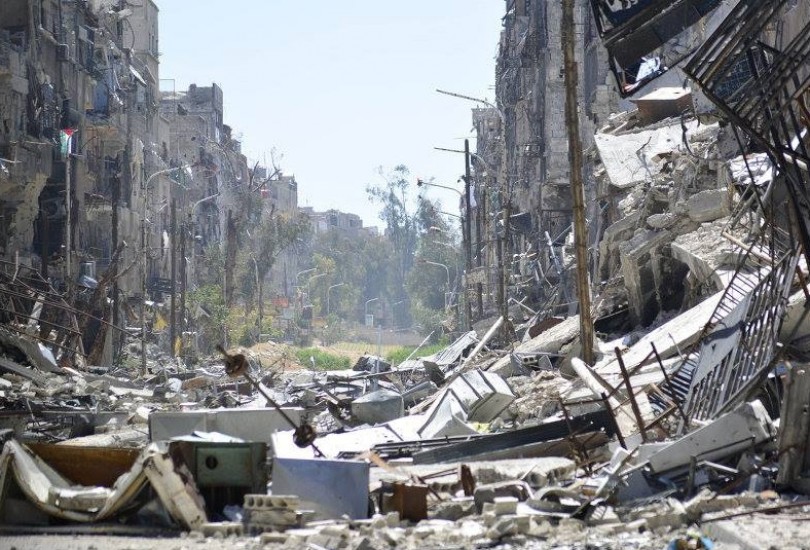 اشتباكات بين الثوار وتنظيم داعش في مخيم اليرموك والأهالي يستغيثون