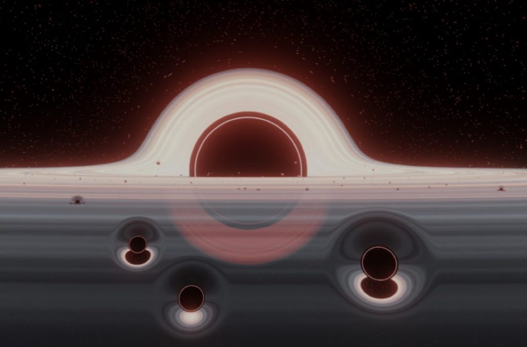 رصد ثلاثة ثقوب سوداء صغيرة عالقة في مدار ثقب أسود عملاق